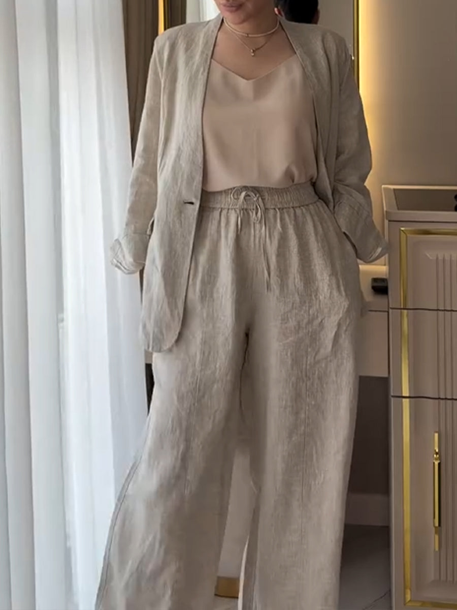 Two-piece Set Featuring A Casual Knit Cotton Top With Cut-out Details And Contrasting Color Trims, Paired With Linen-cotton Blend Trousers.