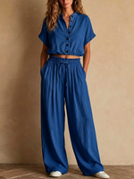 Two-piece Linen Set Featuring A Cropped, Half-button Top With A Stand Collar, Wooden Buttons, And Roll-up Sleeves, Paired With Wide-leg Trousers Featuring An Elastic Drawstring Waist