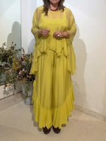 Stylish And Flowy Two-piece Set Featuring A Ruffled Top And Trousers.