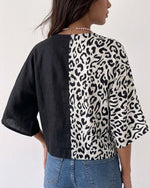 Casual-chic Linen And Cotton Top Featuring A Solid Color And Leopard Print Panel Design.