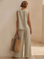 Minimalist, Relaxed-fit Textured Sleeveless Top With Partial Button Placket And Matching Draped, Side-slit Wide-leg Trousers Set