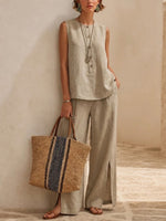 Minimalist, Relaxed-fit Textured Sleeveless Top With Partial Button Placket And Matching Draped, Side-slit Wide-leg Trousers Set